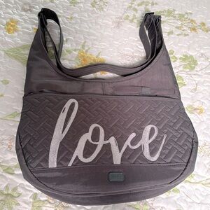 LUG
Canopy Crossbody bag w/ LOVE Lettering and 6 interior pockets.